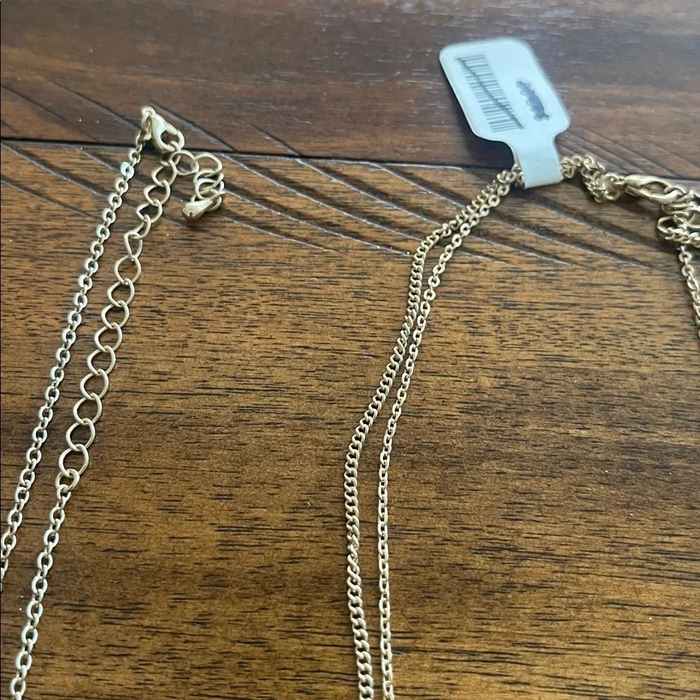 Bundle of 4 stackable fashion necklaces with pendants from Urban Outfitters